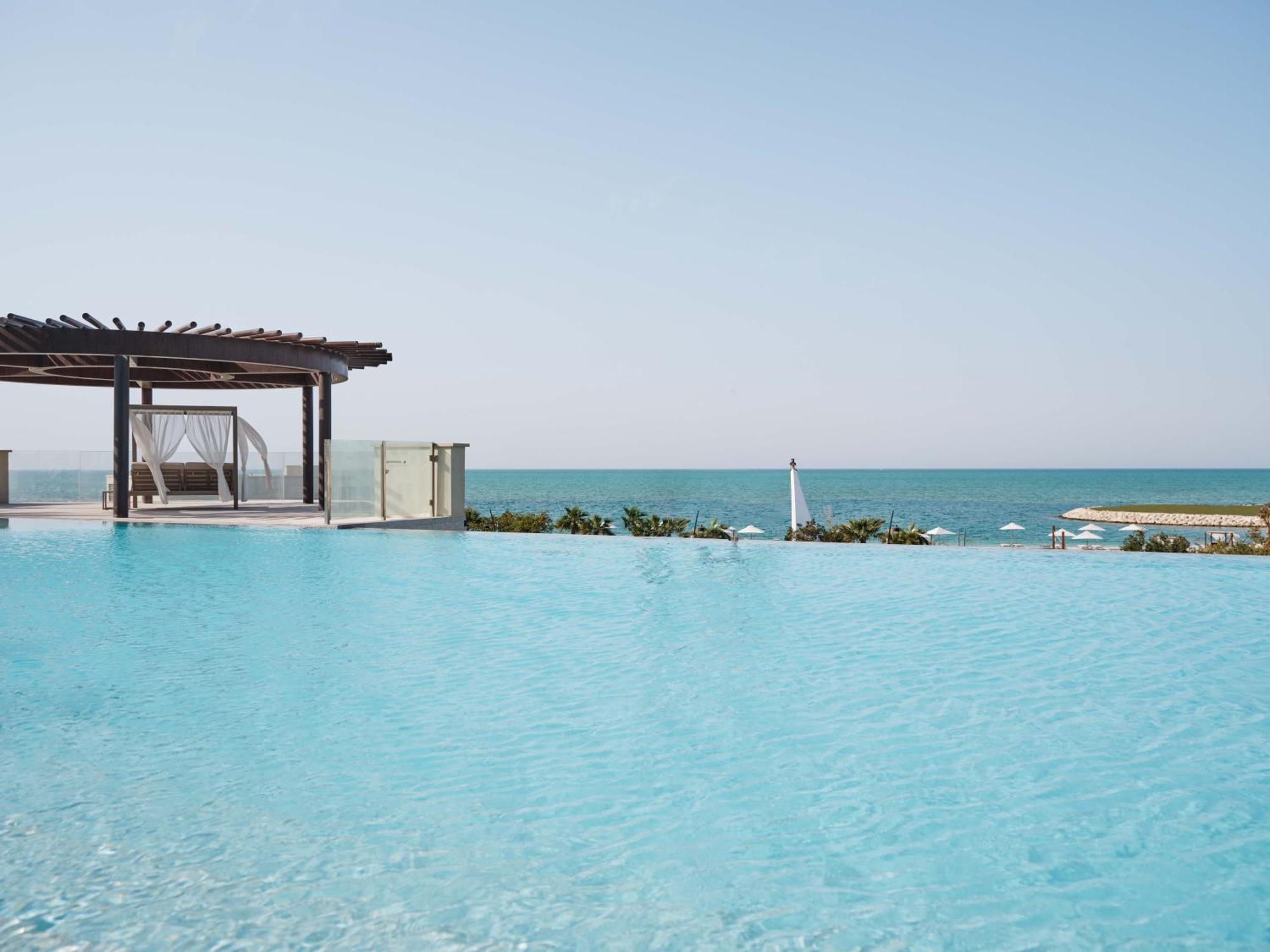 Jumeirah Gulf Of Bahrain Manama Exterior photo Infinity pool at the Kempinski, Muscat